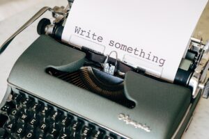 Pictured: A type writer with the words "Write Something" typed on the paper.