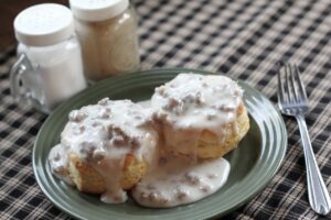 The Power of a Testimony blog post by Ken Walker Writer. Pictured: A plate of biscuits and gravy.