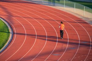 Christianity Still Learning to Turn the Other Cheek blog post by Ken Walker Writer. Pictured: A person on a running track.