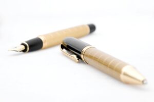Grassroots Novelist Keeps Dream Alive blog post by Ken Walker Writer. Pictured: A set of fancy writing pens.