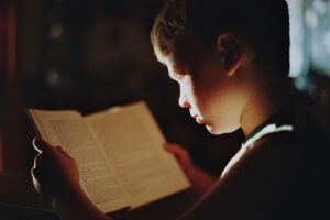 A student reading a Bible.