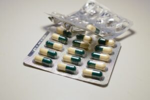 Pictured: Two sets of pills in blister packs. One pack is partially used and bend out of shape.