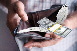 Pictured: Money flying out of an empty wallet