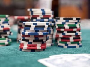 Our Big Beautiful Red Ink blog post by Ken Walker Writer. Pictured: Some poker chips on a green felt topped table like at a casino.