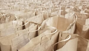 Giving Thanks Amid Grief blog post by Ken Walker Writer. Pictured: Rows of open but empty brown paper grocery bags.