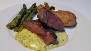An Anniversary for the Ages blog post by Ken Walker Writer. Pictured: A steak dinner with asparagus like in the authors story.