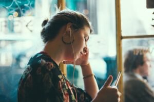 Working Toward Inspiration blog post by Ken Walker Writer. Pictured: A women sitting and waiting with a pencil in her hand.