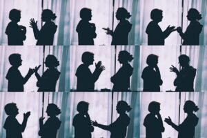 Pictured: multiple silhouetted vignettes of people in animated conversation.